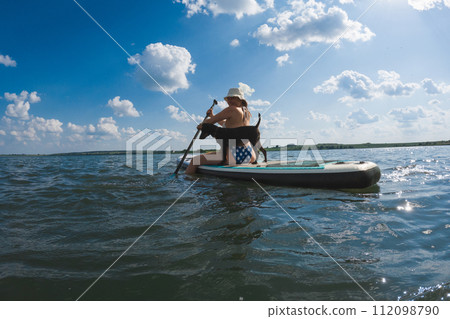 happy woman with dog on supboard 112098790