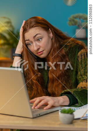 Frustrated business woman having software problems with laptop error or mistake virus notification Frustrated business woman having software problems with laptop error or mistake virus notification 112098863