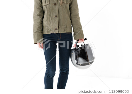 Woman standing with helmet on white background 112099003