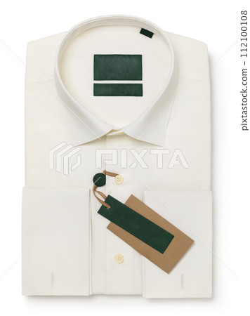 Folded men's shirt with long sleeves in ivory color isolated on a white background, top view, template for designer 112100108
