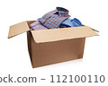 Open cardboard box full of men's folded shirts isolated on white background 112100110