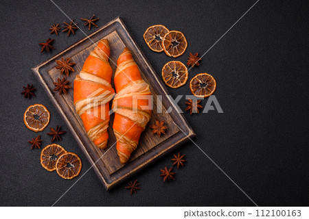 Delicious fresh, crispy French croissants with sweet filling Delicious fresh, crispy French croissants with sweet filling 112100163