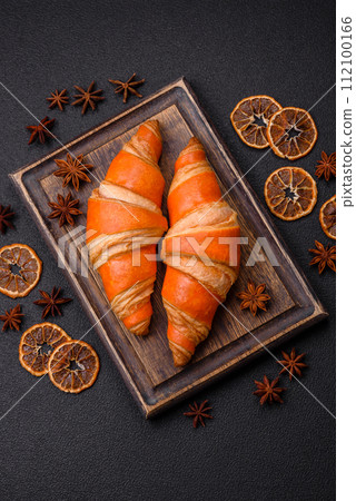 Delicious fresh, crispy French croissants with sweet filling Delicious fresh, crispy French croissants with sweet filling 112100166