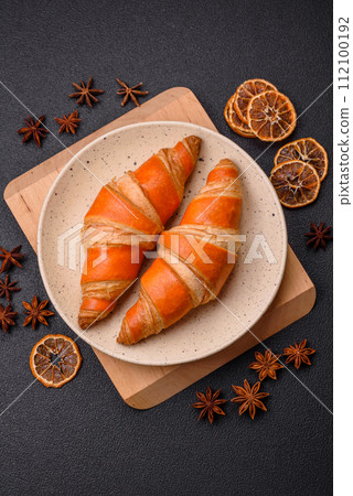 Delicious fresh, crispy French croissants with sweet filling  112100192