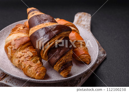 Delicious fresh, crispy French croissants with sweet filling  112100238