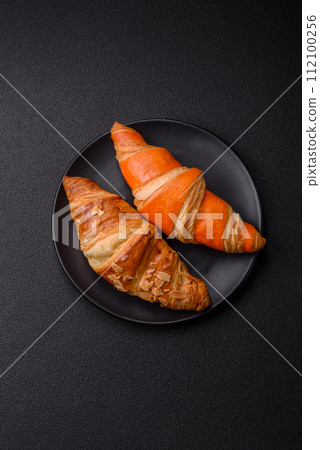 Delicious fresh, crispy French croissants with sweet filling  112100256