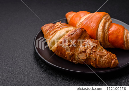 Delicious fresh, crispy French croissants with sweet filling  112100258