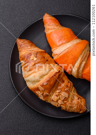 Delicious fresh, crispy French croissants with sweet filling  112100261