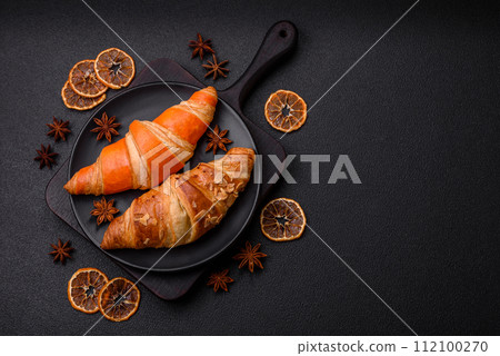 Delicious fresh, crispy French croissants with sweet filling Delicious fresh, crispy French croissants with sweet filling 112100270