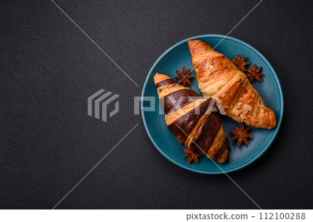 Delicious fresh, crispy French croissants with sweet filling  112100288