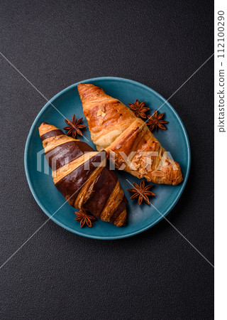 Delicious fresh, crispy French croissants with sweet filling  112100290