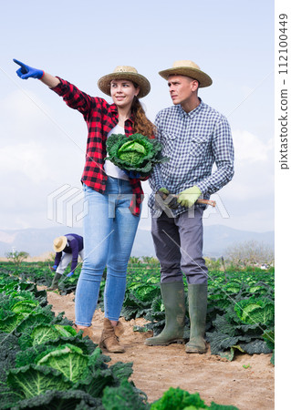 Two farmers are planning work on field 112100449