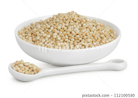 Sorghum seeds in ceramic bowl and spoon isolated on white background with full depth of field. 112100580