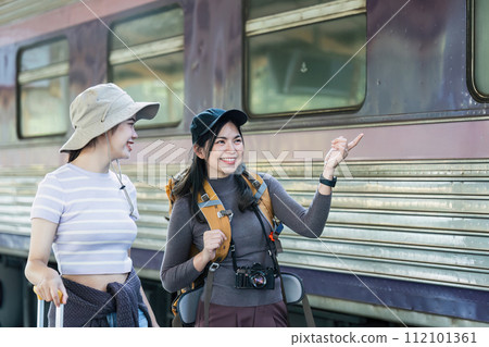 Woman using mobile phone while travel by train. travel concept Woman using mobile phone while travel by train. travel concept 112101361