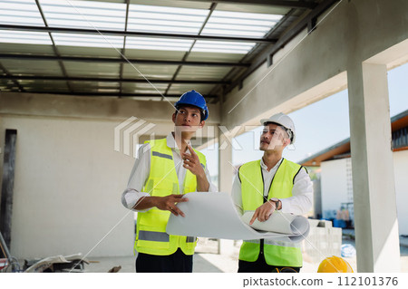 team engineer, foreman, architect meeting for colleagues discussing and checks construction blueprints at onsite team engineer, foreman, architect meeting for colleagues discussing and checks construction blueprints at onsite 112101376