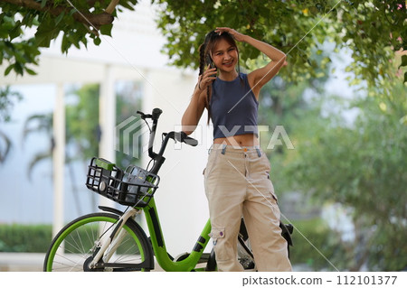 Happy Asian young woman ride bicycle in park, street city her smiling using bike of transportation, ECO friendly, People eco lifestyle concept Happy Asian young woman ride bicycle in park, street city her smiling using bike of transportation, ECO friendly, People eco lifestyle concept 112101377