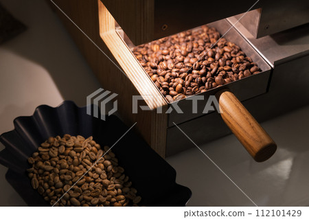 A portion of roasted arabica coffee beans just after roasting A portion of roasted arabica coffee beans just after roasting 112101429