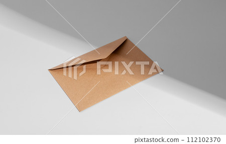 Kraft brown envelope, paper letter, light and shadow 112102370