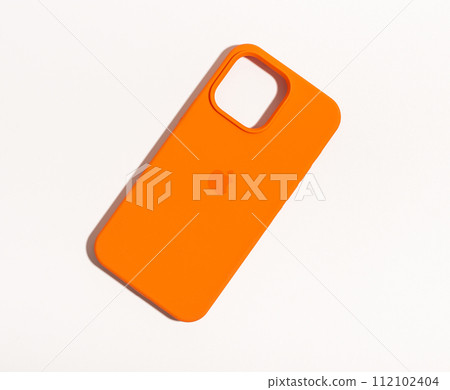 Berlin Germany January 21 2024 bright orange phone case protecting iphone Berlin Germany January 21 2024 bright orange phone case protecting iphone 112102404