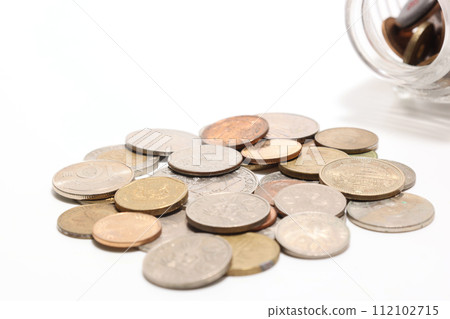 Coins from different countries on a white background 112102715
