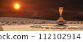Desert Meditation: Balancing Stones against a Fiery Sunset Sky 112102914