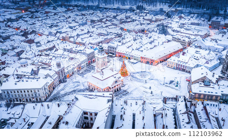 Brasov, Romania, Transylvania - Council Square and Christmas Tree, aerial winter view. 112103962