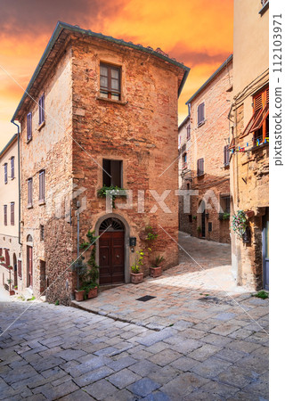 Volterra, Tuscany. Medieval cobbled street, historical city in Italy Volterra, Tuscany. Medieval cobbled street, historical city in Italy 112103971