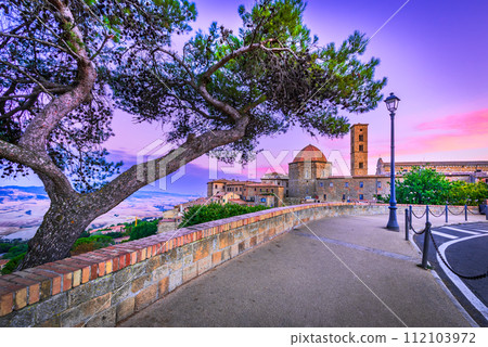 Volterra, Tuscany - Colored sunrise, tuscan city in Italy, travel destination. Volterra, Tuscany - Colored sunrise, tuscan city in Italy, travel destination. 112103972