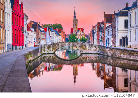 Bruges, Belgium, Flanders. Beuatiful Spiegelrei Canal, famous in Brugge city, sunrise colors. Bruges, Belgium, Flanders. Beuatiful Spiegelrei Canal, famous in Brugge city, sunrise colors. 112104047