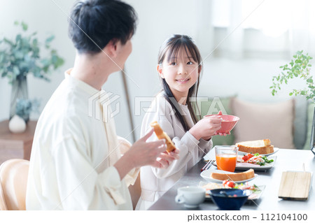 family eating at the dining room 112104100
