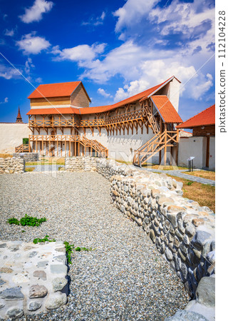 Feldioara, Romania. Medieval fortress Marienburg in Transylvania, summer sunny landscape. 112104228