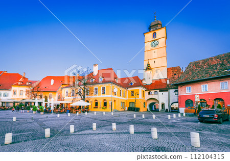 Sibiu, Romania. Sunset light, Council Tower in Lesser Square. Medieval city in Transylvania. Sibiu, Romania. Sunset light, Council Tower in Lesser Square. Medieval city in Transylvania. 112104315