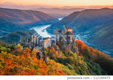 Beautiful landscape with Aggstein castle ruin and Danube River at sunset in Wachau valley Austria. 112104475