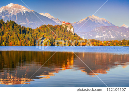Bled, Slovenia -  Julian Alps and Church Santa Maria, beautiful sunset. 112104507