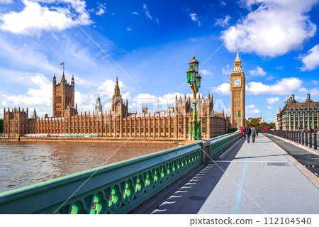 London, United Kingdom. Big Ben and Parliament Building, beautiful blue sky with white clouds. London, United Kingdom. Big Ben and Parliament Building, beautiful blue sky with white clouds. 112104540