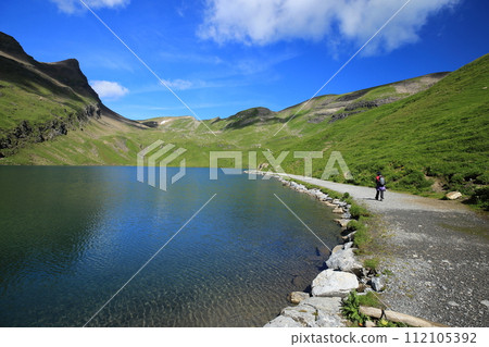 A mountain trail along the shores of Lake Bach (Canton Bern, Switzerland) A mountain trail along the shores of Lake Bach (Canton Bern, Switzerland) 112105392