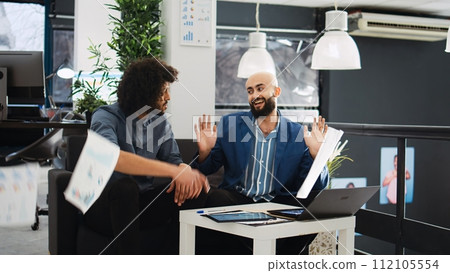 Furious manager showing disappointment in business office, throwing documents around. CEO screaming at employee and being angry with company results, aggressive entrepreneurship. 112105554