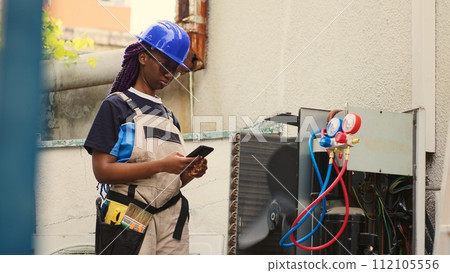 Precise technician apprentice asking master for advice over the phone about out of order air conditioner internal components. Mechanic calling expert to inform him of needed condenser repairments 112105556