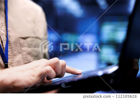 Expert repairman doing routine checkup in blockchain technology application specific integrated circuit supercomputer facility. Admin doing technical investigations in crypto mining farm, close up 112105628