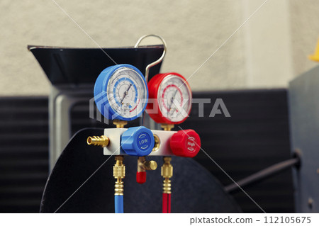 Close up of broken manometers used for checking hvac system freon pressure, in need of servicing. Set of barometer high or low refrigerant levels benchmarking air conditioner component 112105675