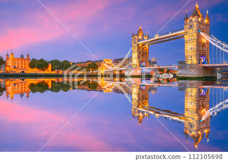 London, England. The Tower and Tower Bridge, river Thames, United Kingdom capital spotlight. 112105698