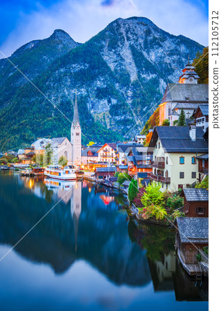 Hallstatt, Austria. Small village, misty scenic landscape twilight hour, Austrian Alps. 112105712