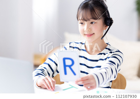 A girl taking English conversation classes online A girl taking English conversation classes online 112107930