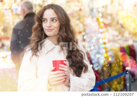 Woman at Christmas market 112109207