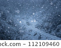 Ojiya City, Niigata Prefecture, Iiyama Line: A one-car train running through steep mountains with beautiful falling snow 112109460