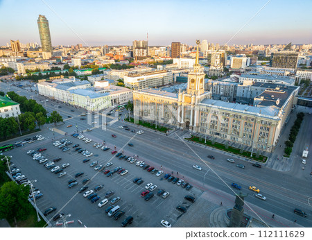 Yekaterinburg City Administration or City Hall and Central square at summer evening. Evening city in the summer sunset, Aerial View. Yekaterinburg City Administration or City Hall and Central square at summer evening. Evening city in the summer sunset, Aerial View. 112111629