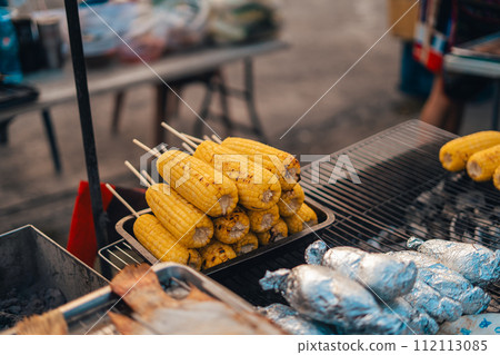 Grilled corn at the street market Grilled corn at the street market 112113085