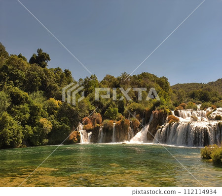 Plitvice National Park, Croatia. Amazing view over the lakes and waterfalls surrounded by forest. Plitvice National Park, Croatia. Amazing view over the lakes and waterfalls surrounded by forest. 112114934