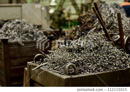 Selective focus no people shot of metal shavings in containers in workshop, copy space Selective focus no people shot of metal shavings in containers in workshop, copy space 112115015