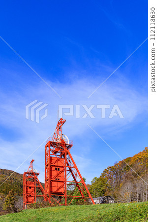Two shaft winding machines towering over Coal Mine Memorial Forest Park in Bibai City, Hokkaido [October] 112118630
